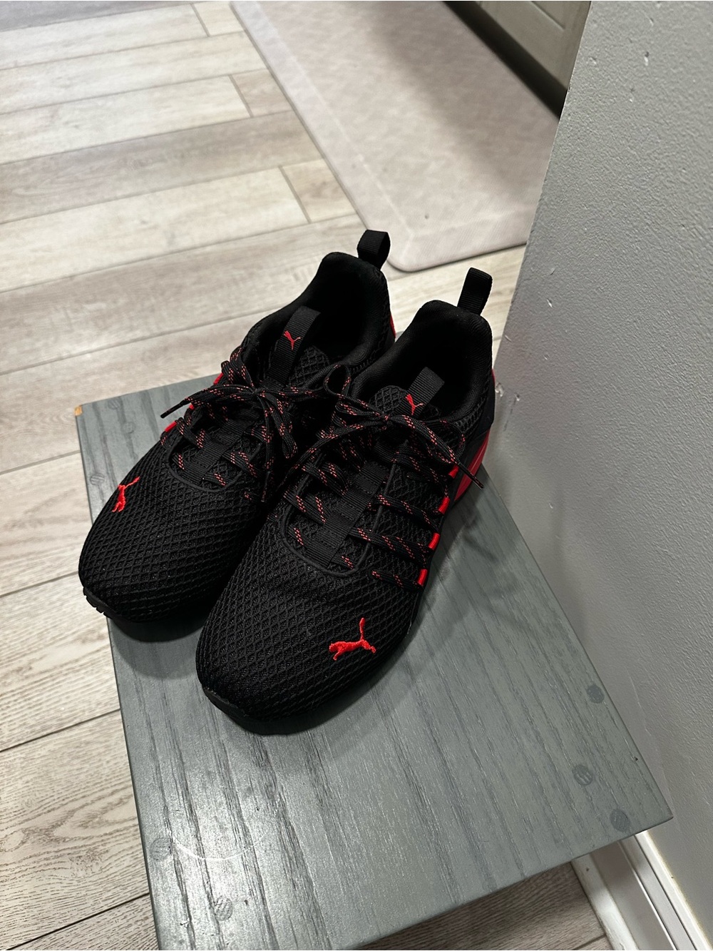 Puma Black Athletic Sneakers with Red Accents